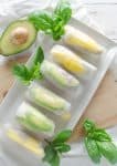 Mango and Avocado Spring Rolls! So easy and packed with nutrition: juicy mango, creamy avocado, buckwheat noodles and tofu. Served with a spicy cilantro dipping sauce. #vegan #vegetarian | www.delishknowledge.com