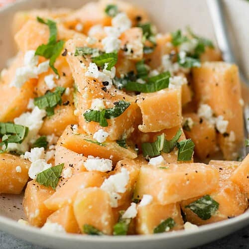 Melon, Mint And Feta Salad! This Is The Perfect Sweet And Salty Combination. Great Side-Dish For Summer, Potlucks And Cookouts. Cubes Of Melon, Feta, Mint And A Lime Dressing. Vegetarian And Gluten-Free. | Delishknowledge.com