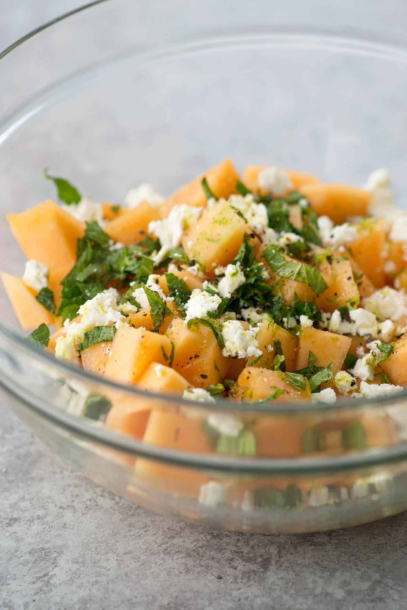 Melon, Mint And Feta Salad! This Is The Perfect Sweet And Salty Combination. Great Side-Dish For Summer, Potlucks And Cookouts. Cubes Of Melon, Feta, Mint And A Lime Dressing. Vegetarian And Gluten-Free. | Delishknowledge.com