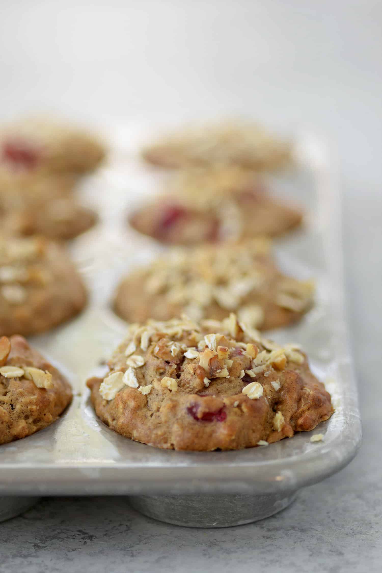 Oatmeal Cranberry Muffins in a muffin tin