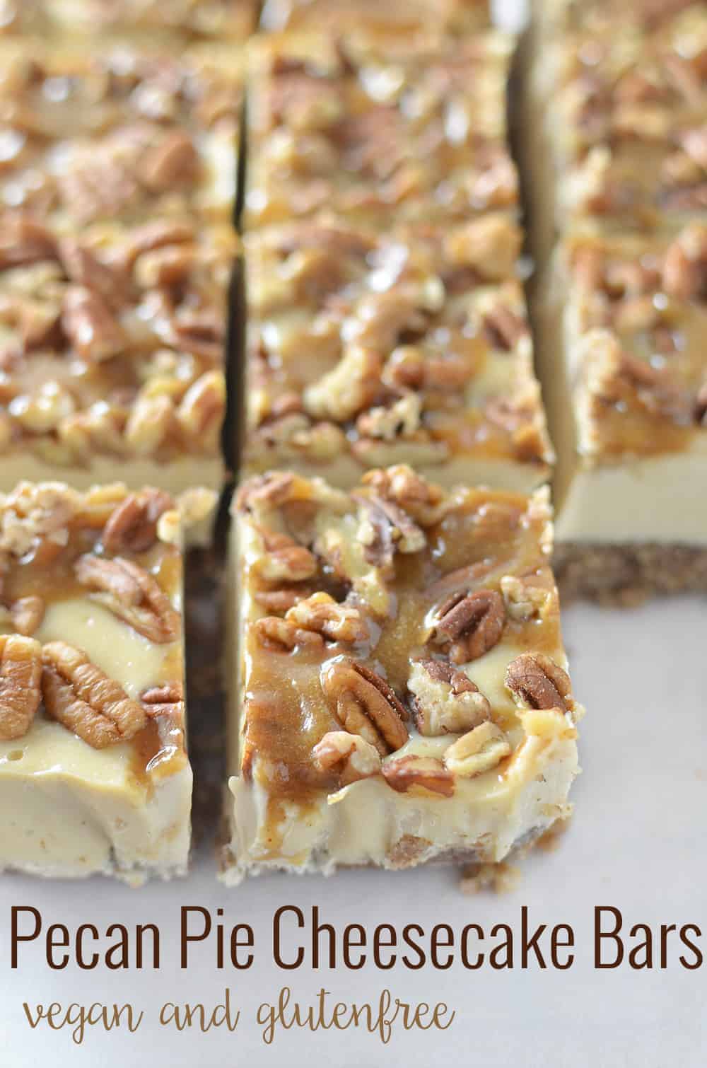 Pecan Pie Cheesecake Bars! Vegan and Gluten-Free! You are going to love these clean eating bars! Pecan Pie crust with dairy-free, no bake cheesecake filling. Topped with toasted pecans and maple-caramel syrup. A must make for Thanksgiving, Christmas or the Holidays! | www.delishknowledge.com