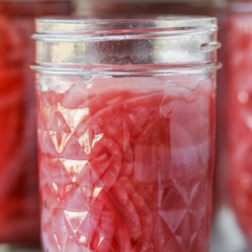 Pickled Red Onions 12 A Glass Mason Jar Filled With Bright Pink Pickled Red Onions.