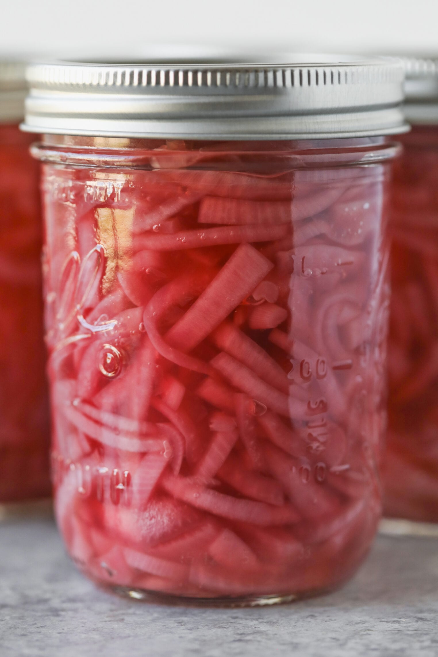 Pickled Red Onions 9 A Glass Mason Jar Filled With Bright Pink Pickled Red Onions.