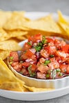 fresh salsa recipe in a bowl with chips