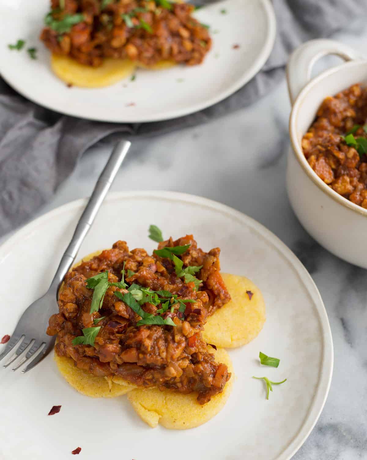 Polenta Cakes With Tempeh Bolognese! Crispy Polenta Topped With A Meaty, Vegan Ragu. Healthy Comfort Food! | Www.delishknowledge.com 