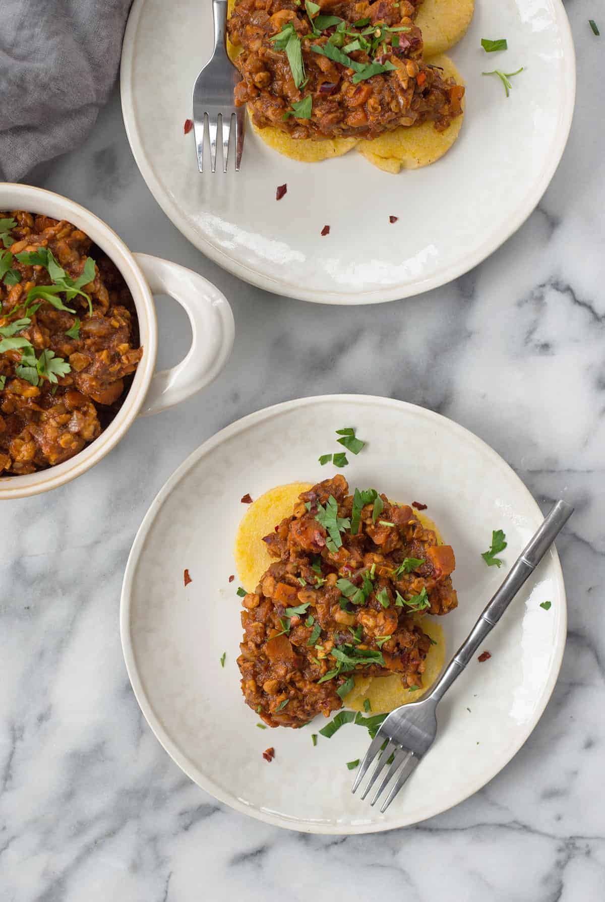 Polenta Cakes With Tempeh Bolognese! Crispy Polenta Topped With A Meaty, Vegan Ragu. Healthy Comfort Food! | Www.delishknowledge.com 