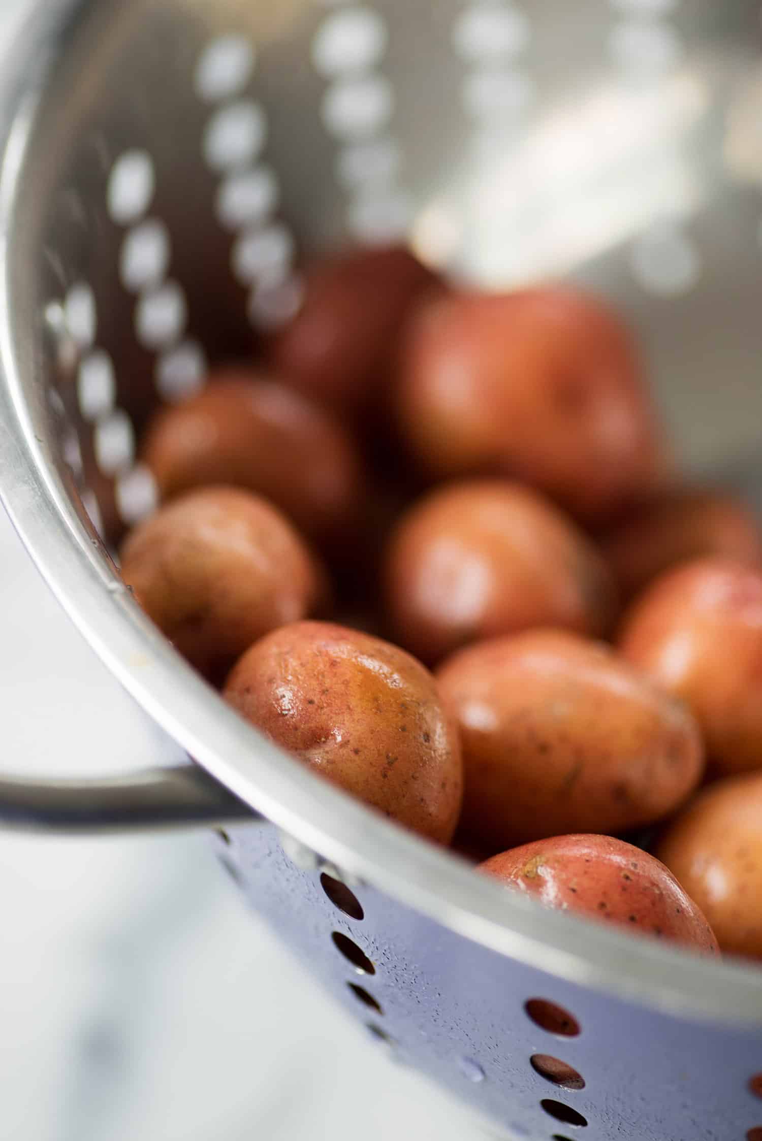 Close up of little potatoes in a colander 