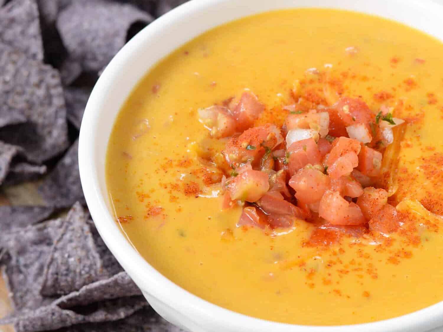 Pumpkin Chipotle Queso Dip! Looking for a unique appetizer? Try this dip! Spicy, creamy and perfectly cheesy! #vegetarian #queso #pumpkin #dip #appetizer #snack #holiday #fall #recipe #healthyrecipe #recipeidea | www.delishknowledge.com