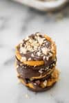 Pumpkin Chocolate Cups! You've gotta make these for Fall and Halloween. A chocolate cup base with creamy pumpkin filling, more chocolate and almonds. Vegan and Gluten-Free. | www.delishknowledge.com