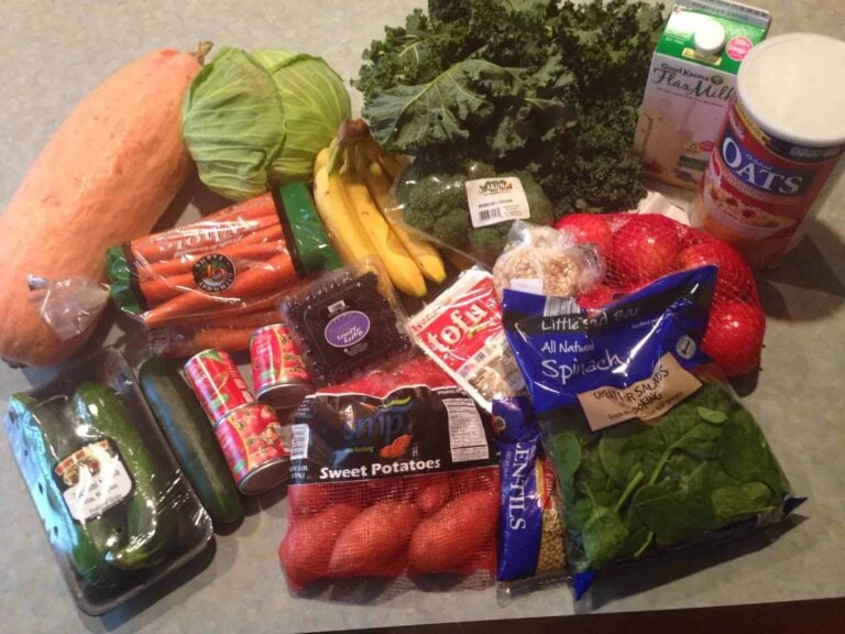 Grocery Items Like Vegetables, Fruits, Cans, And Milk