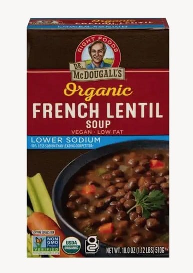 The 10 Healthiest Canned Soups 6 Front View Of A Dr. Mcdougall’s Organic French Lentil Soup Carton, Featuring A Bowl Of Soup With Parsley, Celery, And Tomatoes; Highlights Vegan, Low Fat, Lower Sodium—One Of The Healthiest Canned Soups.