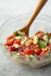 Simple Tomato and Tofu Feta Salad! This salad is so simple and easy; tomatoes, cucumbers, basil, parsley and homemade tofu feta. Vegan and gluten-free | www.delishknowledge.com