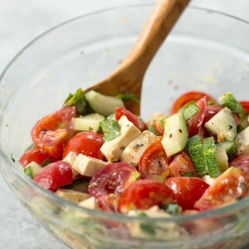 Simple Tomato And Tofu Feta Salad! This Salad Is So Simple And Easy; Tomatoes, Cucumbers, Basil, Parsley And Homemade Tofu Feta. Vegan And Gluten-Free | Www.delishknowledge.com