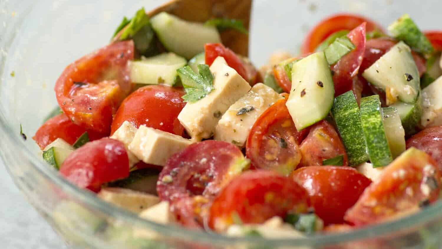 Simple Tomato And Tofu Feta Salad! This Salad Is So Simple And Easy; Tomatoes, Cucumbers, Basil, Parsley And Homemade Tofu Feta. Vegan And Gluten-Free | Www.delishknowledge.com
