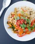 Slow Cooker Red Curry! Lots of vegetables & chickpeas cooked in a coconut-red curry sauce. Throw everything in the slow cooker and it's ready for dinner when you get home from work! #Vegan & #Glutenfree