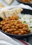 Slow Cooker Vegan Chana Masala. Chickpeas cooked in a fragrant, spiced tomato sauce. Make in the morning for dinner at night! Vegan and Gluten-Free | www.delishknowledge.com