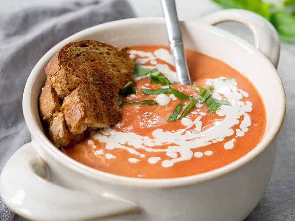 Creamy Vegan Slow Cooker Tomato Soup In White Bowl