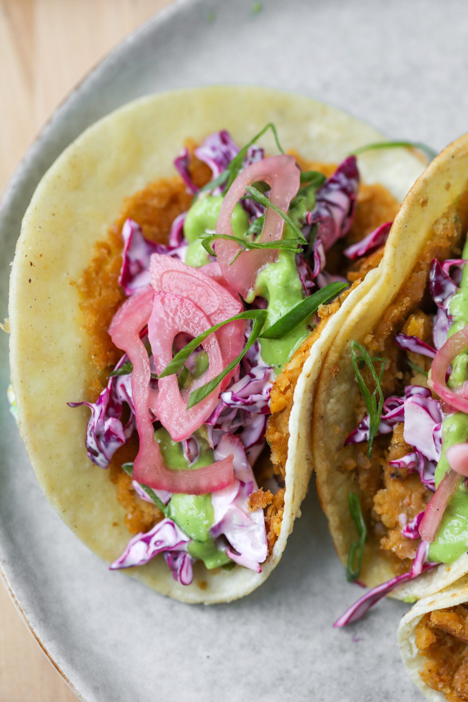 Smashed Chickpea Tacos 10 Two Smashed Chickpea Tacos On A Plate, Filled With Crispy Fried Filling, Shredded Purple Cabbage, Pickled Red Onions, Green Sauce, And Fresh Herbs In Soft Corn Tortillas.