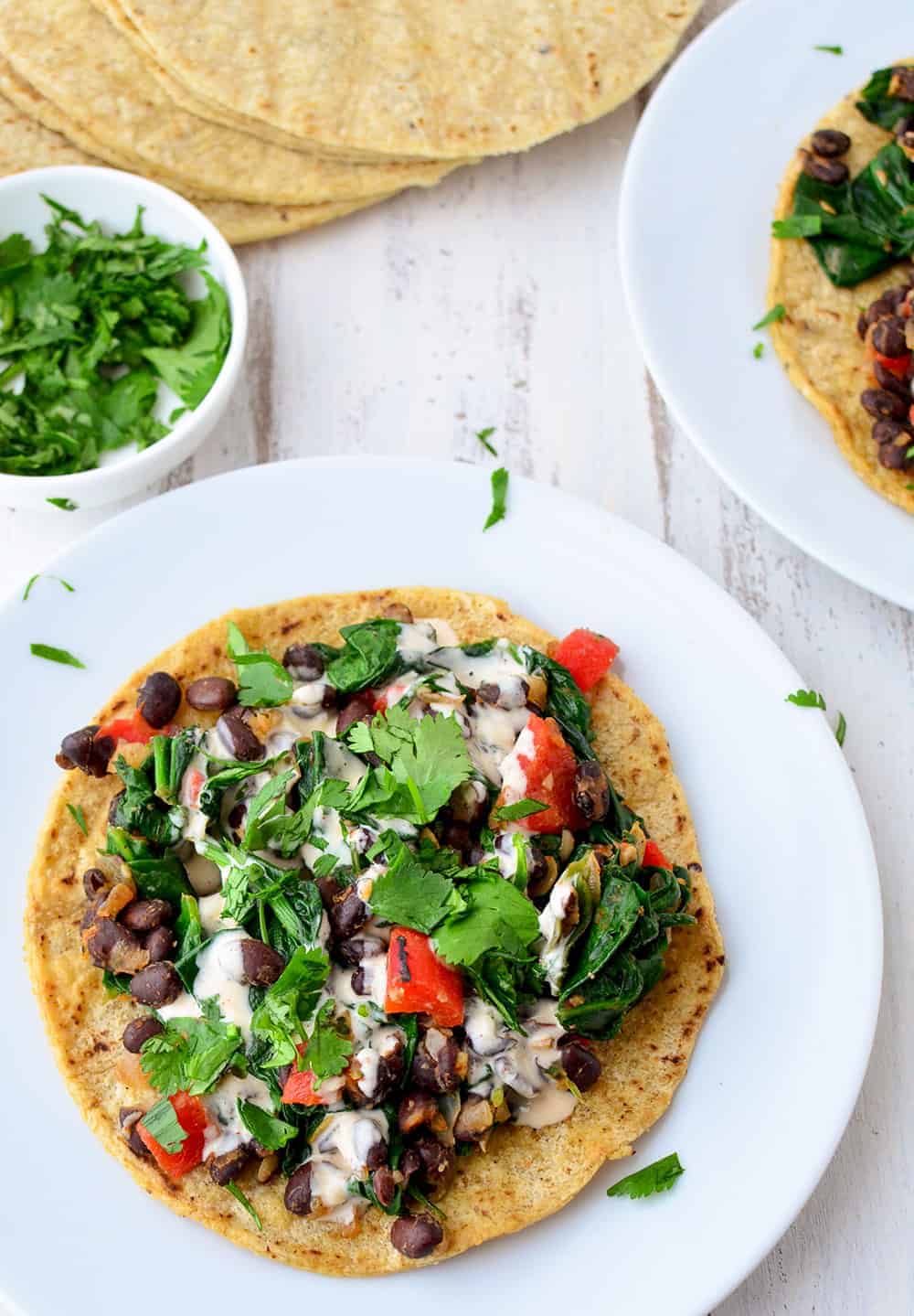 Smoky Black Bean Tostadas! Black Bean And Spinach Filling Topped With A Smoky Paprika Sauce. Vegan And Gluten-Free. | Www.delishknowledge.com