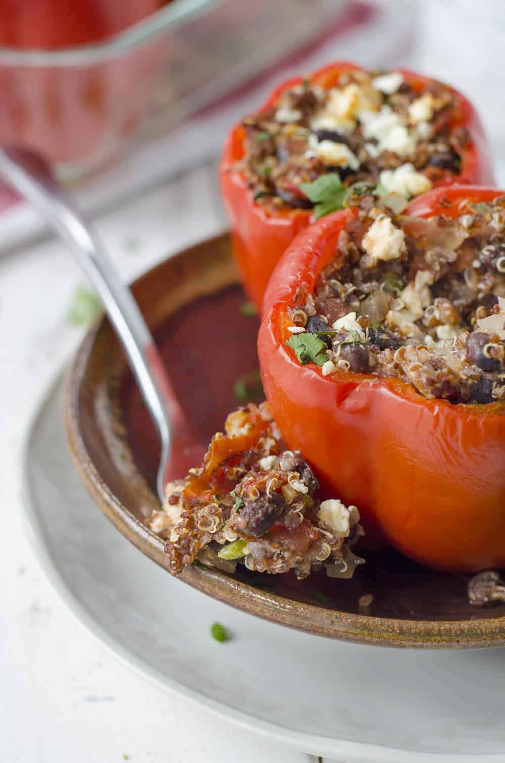 Southwestern Quinoa Stuffed Peppers! Vegetarian And Gluten-Free! These Protein Packed Peppers Are So Easy To Put Together And Perfect For Busy Weeknights. Save These To Make Later! | Www.delishknowledge.com