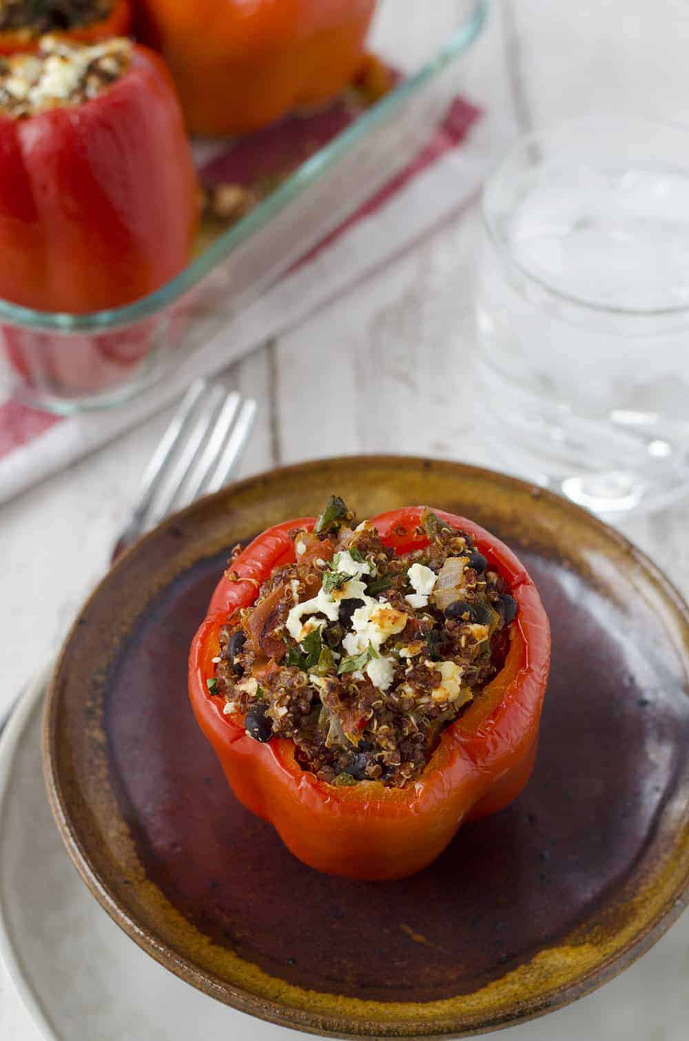 Southwestern Quinoa Stuffed Peppers! Vegetarian And Gluten-Free! These Protein Packed Peppers Are So Easy To Put Together And Perfect For Busy Weeknights. Save These To Make Later! | Www.delishknowledge.com