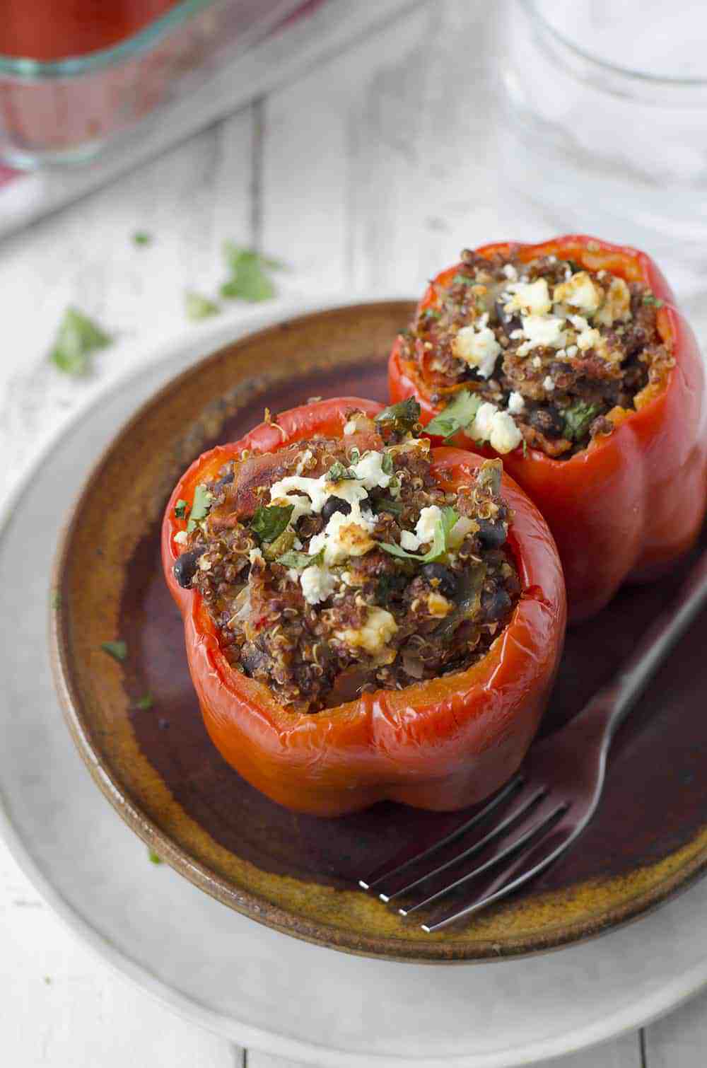 Southwestern Quinoa Stuffed Peppers! Vegetarian And Gluten-Free! These Protein Packed Peppers Are So Easy To Put Together And Perfect For Busy Weeknights. Save These To Make Later! | Www.delishknowledge.com