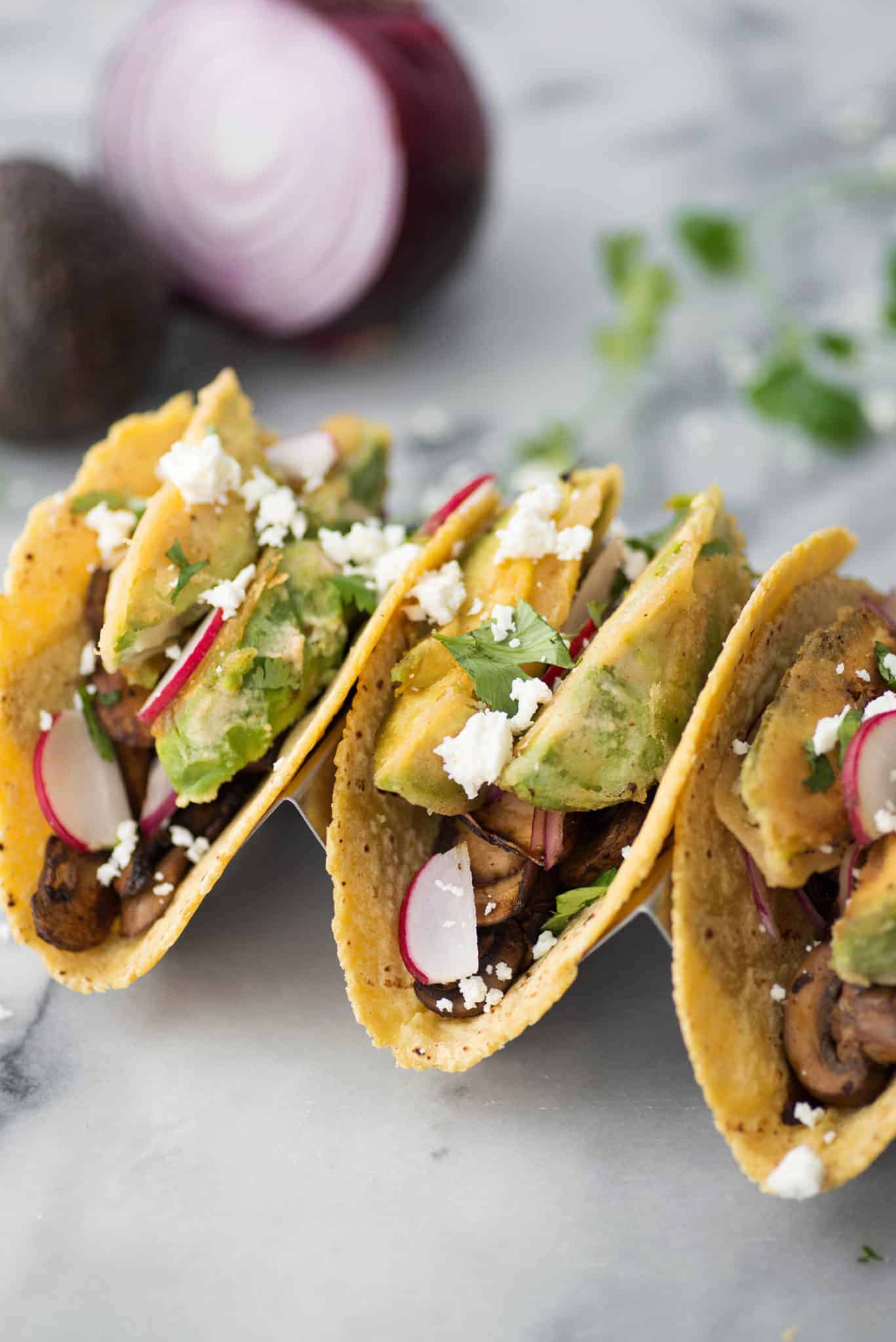 Spicy Mushroom And Black Bean Tacos With Crispy Avocado. These Vegetarian Tacos Are Loaded With Flavor And Texture! Crispy Fried Avocado, Pickled Onions, Spicy Mushroom And Bean Filling And Goat Cheese. | Www.delishknowledge.com