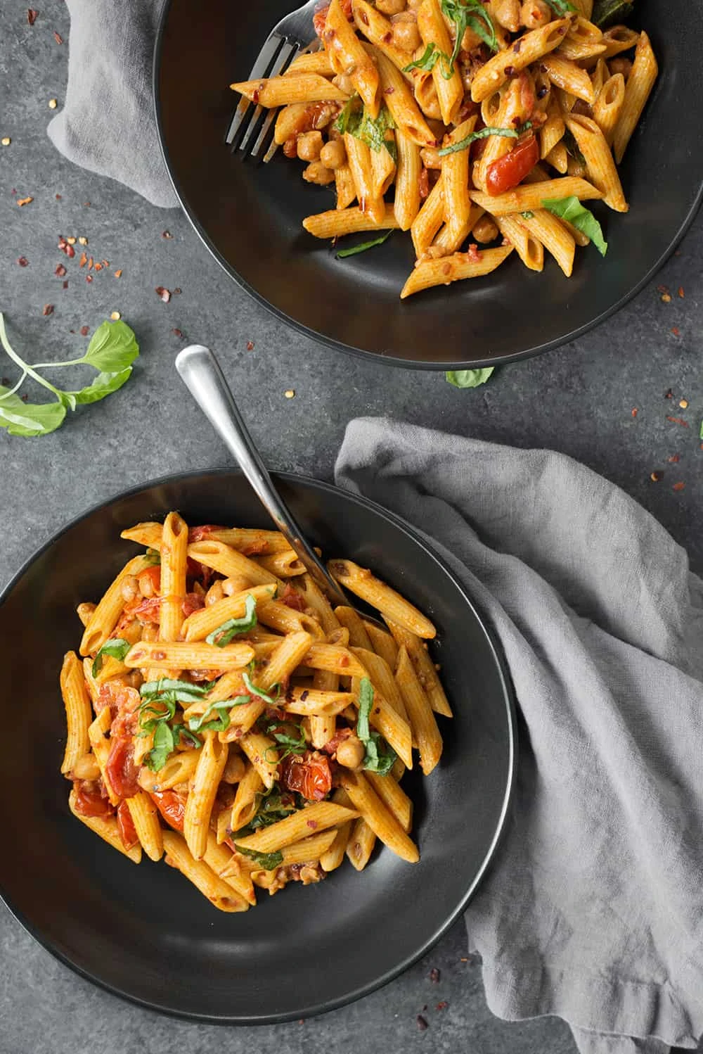 two bowls of vegan penne pasta