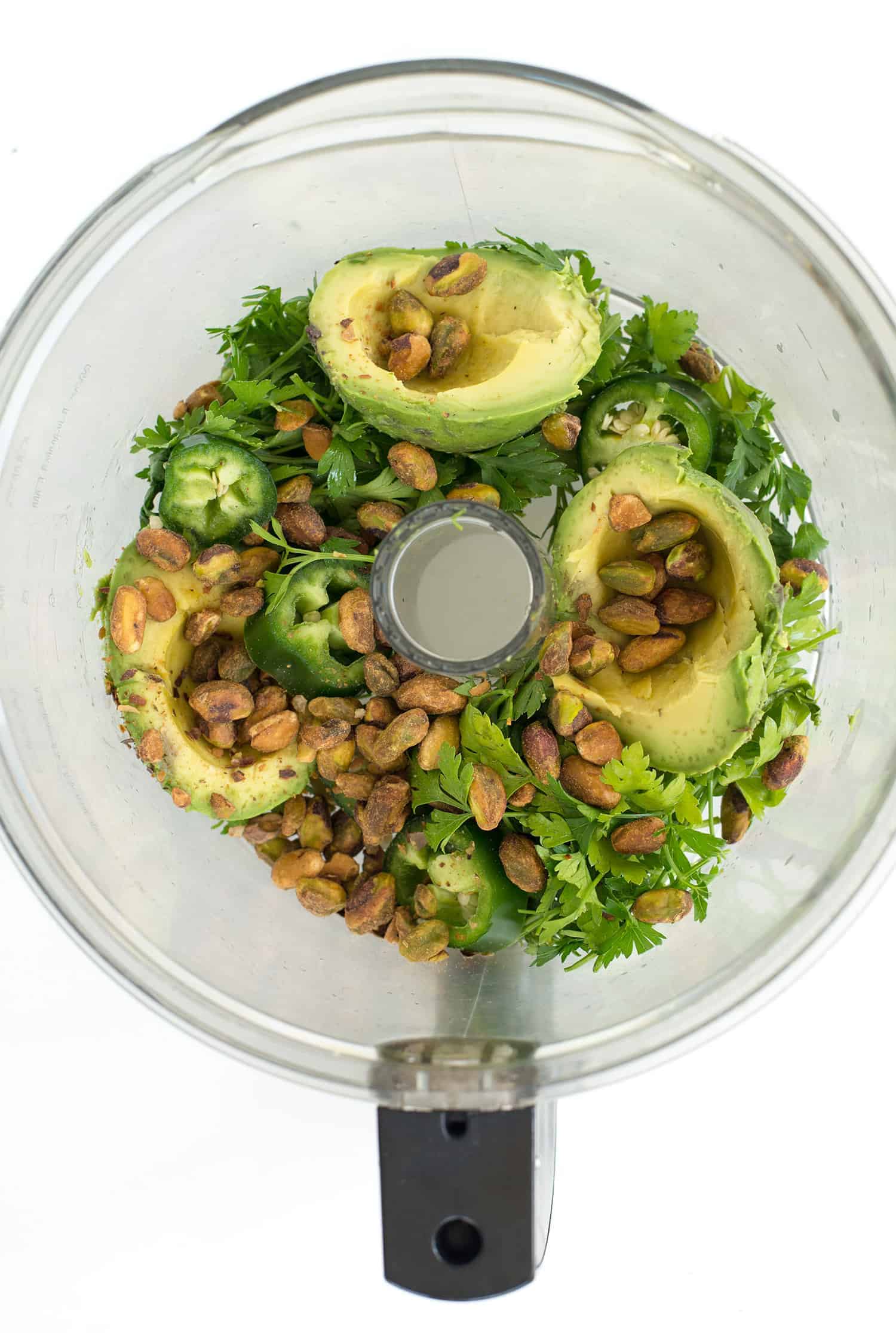 Spicy Green Sauce! Pesto meets guacamole! You are going to love this healthy sauce, perfect for topping on just about everything. Tacos, sandwiches, pasta, ect. Vegan & Gluten-free | www.delishknowledge.com
