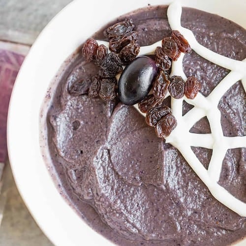Kid-Friendly Halloween Snacks 11 Smoothie Bowl With Yogurt Spider Web And Raisin Spider