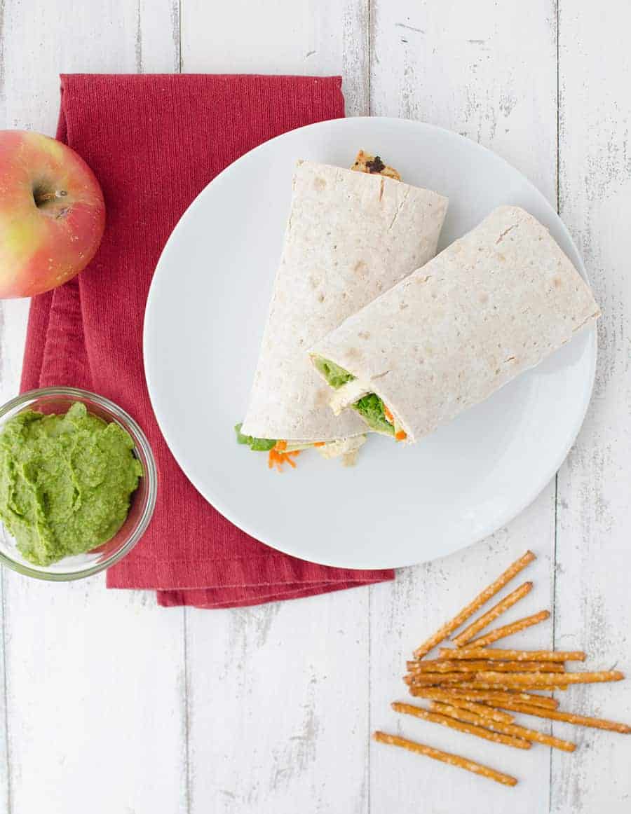 Spinach Hummus! Slightly Spicy Hummus Wrapped Into Whole Wheat Lavish Bread And Topped With Veggies And Lightly Fried Tofu. Healthy And Filling Lunch!