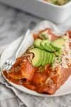 close up photo of spinach and lentil enchiladas