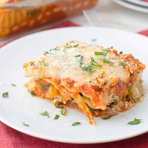 Spring Vegetable Lasagna! Layers Of Zucchini, Spinach, Peas And Creamy Ricotta. Less Than 250 Calories Per Slice. #Vegetarian | Delishknowledge.com