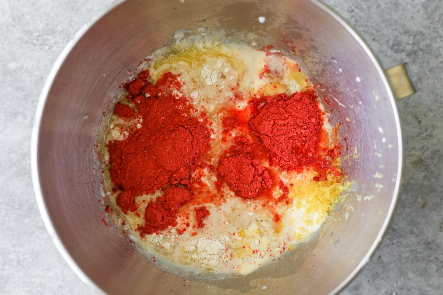 A Mixing Bowl Containing Flour, Sugar, Butter, Milk, And Red Food Coloring Powder, Ready To Be Mixed For Baking Delicious Strawberry Rolls.
