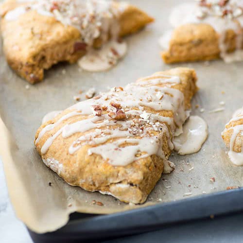 Sweet Potato Pecan Scones With Maple Frosting! You Are Going To Love These Healthy, Vegan Scones! Packed With Sweet Potato Puree, Whole Wheat-Flour And Pecans. Drizzled With Maple Frosting And Covered With More Pecans. | Www.delishknowledge.com