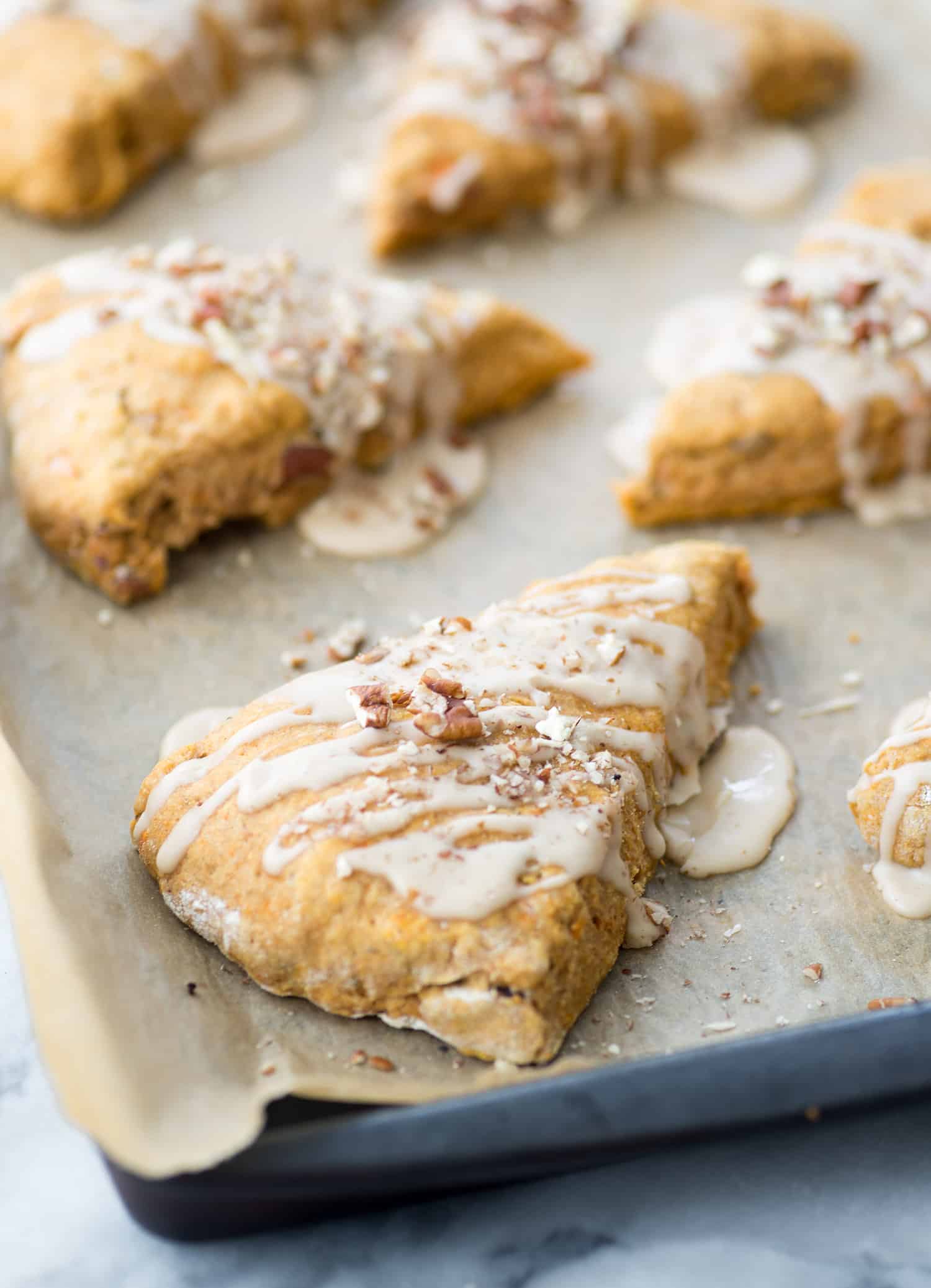 Sweet Potato Pecan Scones With Maple Frosting! You Are Going To Love These Healthy, Vegan Scones! Packed With Sweet Potato Puree, Whole Wheat-Flour And Pecans. Drizzled With Maple Frosting And Covered With More Pecans. | Www.delishknowledge.com 