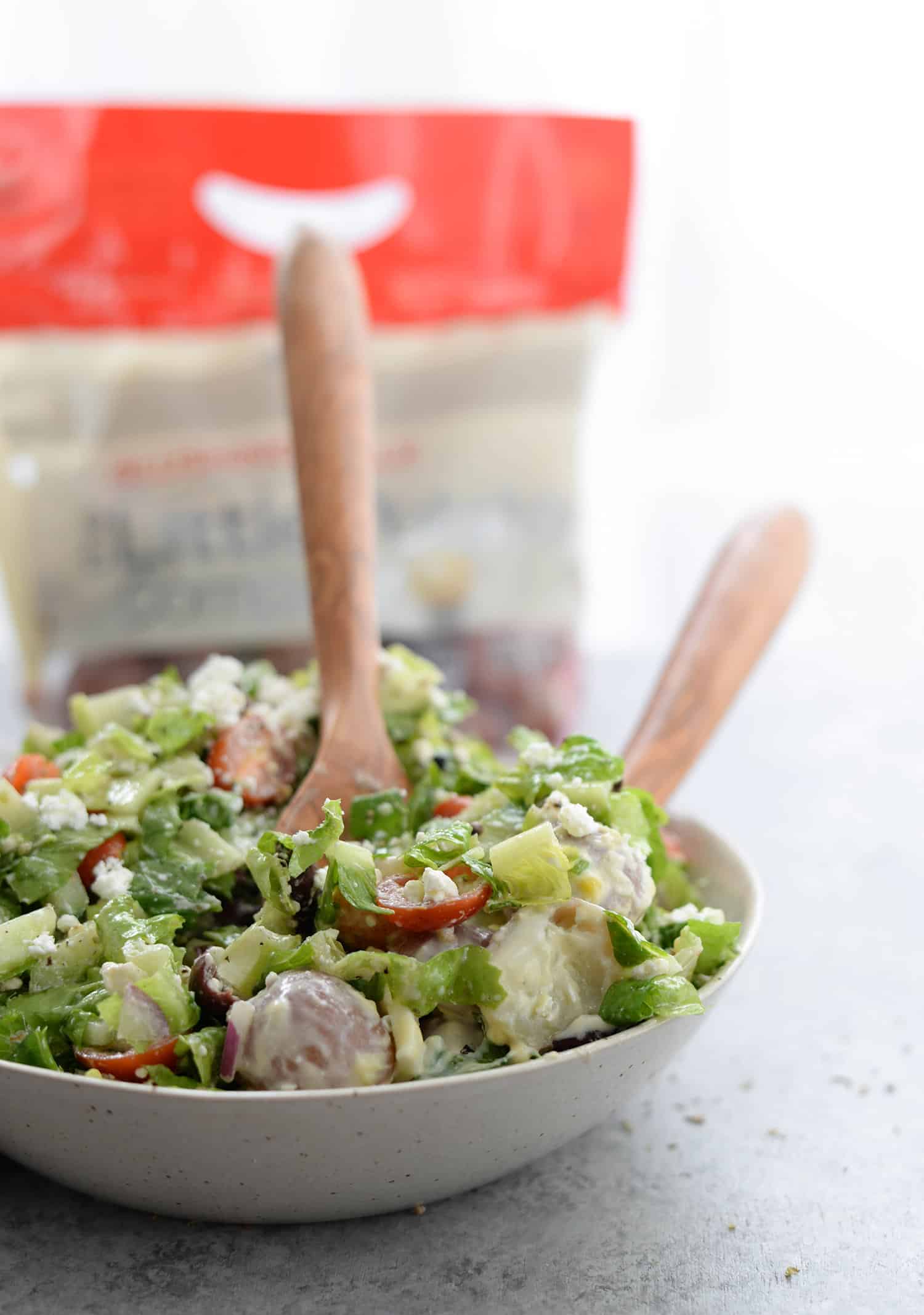 Tarpon Springs Greek Salad With Potato Salad. You'Ve Never Had Greek Salad Like This Before! A Layer Of Potato Salad Topped With Tangy Greek Salad And Homemade Dressing. A Healthy And Delicious Lunch Or Dinner Option. Lightened Up Potato Salad Made With Greek Yogurt. | Www.delishknowledge.com #Glutenfree #Vegetarian #Lunch #Healthy #Salad #Greeksalad #Lowfat #Eatinghealthy #Potatosalad