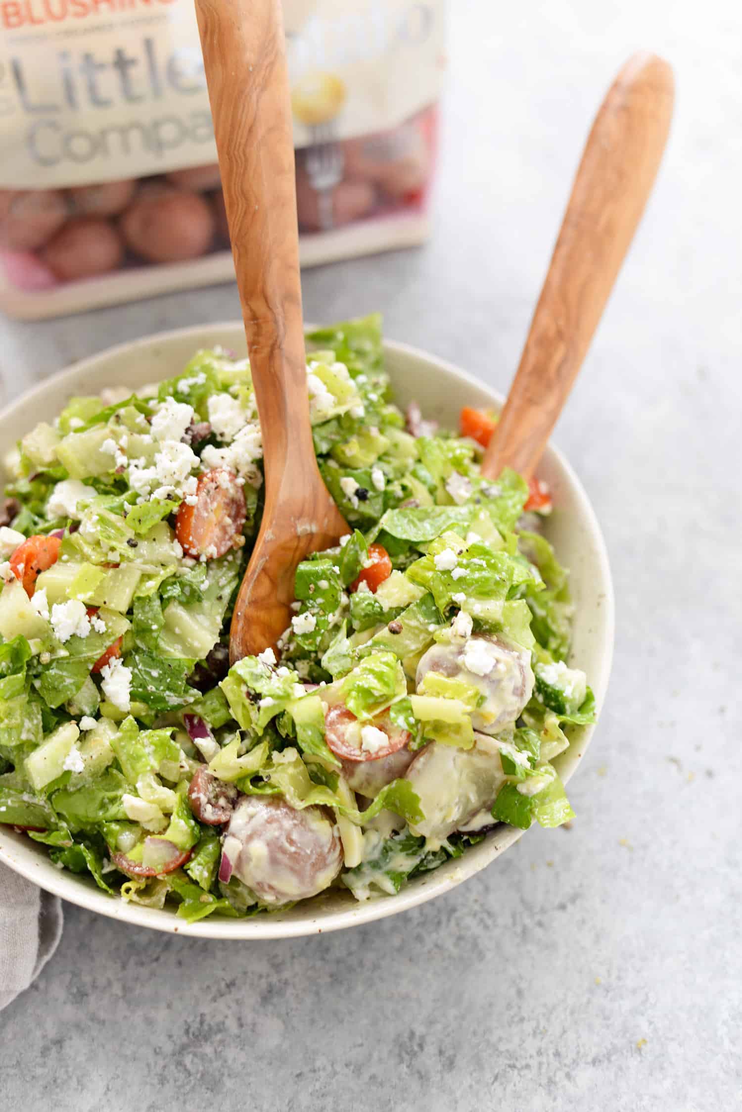 Tarpon Springs Greek Salad With Potato Salad. You'Ve Never Had Greek Salad Like This Before! A Layer Of Potato Salad Topped With Tangy Greek Salad And Homemade Dressing. A Healthy And Delicious Lunch Or Dinner Option. Lightened Up Potato Salad Made With Greek Yogurt. | Www.delishknowledge.com #Glutenfree #Vegetarian #Lunch #Healthy #Salad #Greeksalad #Lowfat #Eatinghealthy #Potatosalad