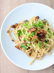 Tempeh Bacon Carbonara! Creamy cauliflower sauce with whole wheat pasta and homemade tempeh bacon! Such a healthy, low-fat recipe that taste like the creamiest pasta you've ever had! Vegan | www.delishknowledge.com