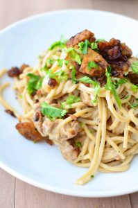 Tempeh Bacon Carbonara! Creamy cauliflower sauce with whole wheat pasta and homemade tempeh bacon! Such a healthy, low-fat recipe that taste like the creamiest pasta you've ever had! Vegan | www.delishknowledge.com