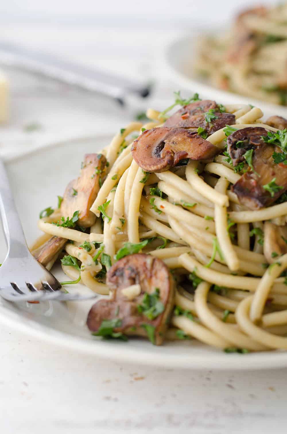 The BEST creamy mushroom pasta! Made with a secret ingredient, this pasta is packed with savory umami flavor and ready in just 20 minutes! Save this for weeknight dinners. | www.delishknowledge.com