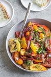 heirloom tomatoes with herbs in a bowl
