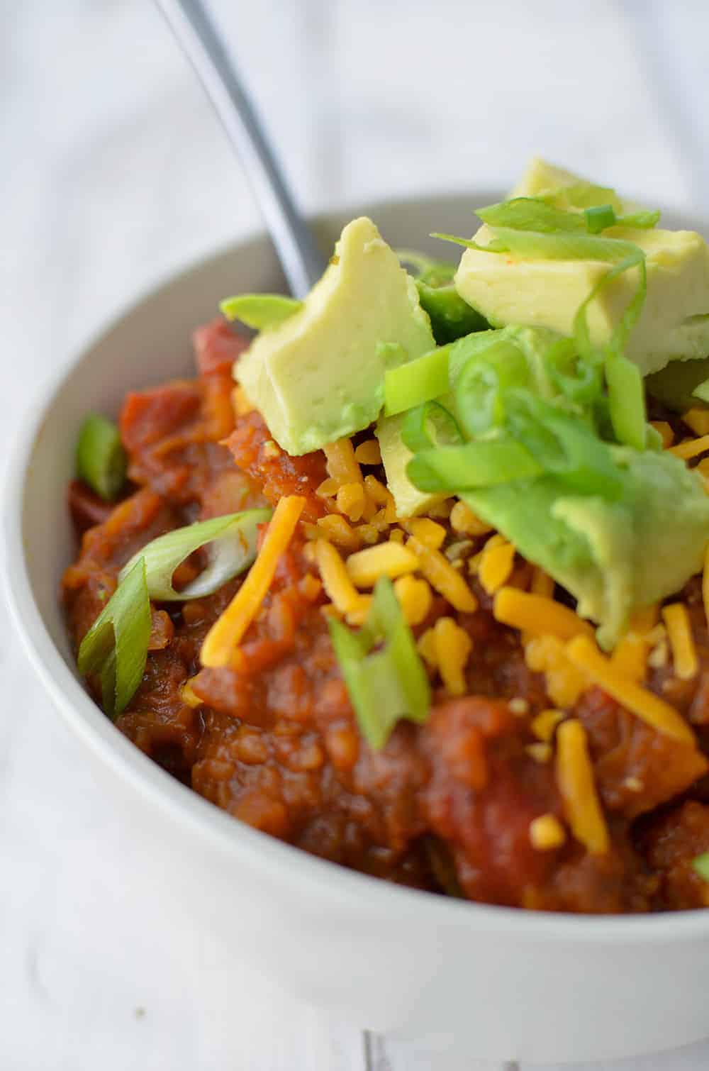 Serve The Chili With Fresh Avocado And Grated Cheese