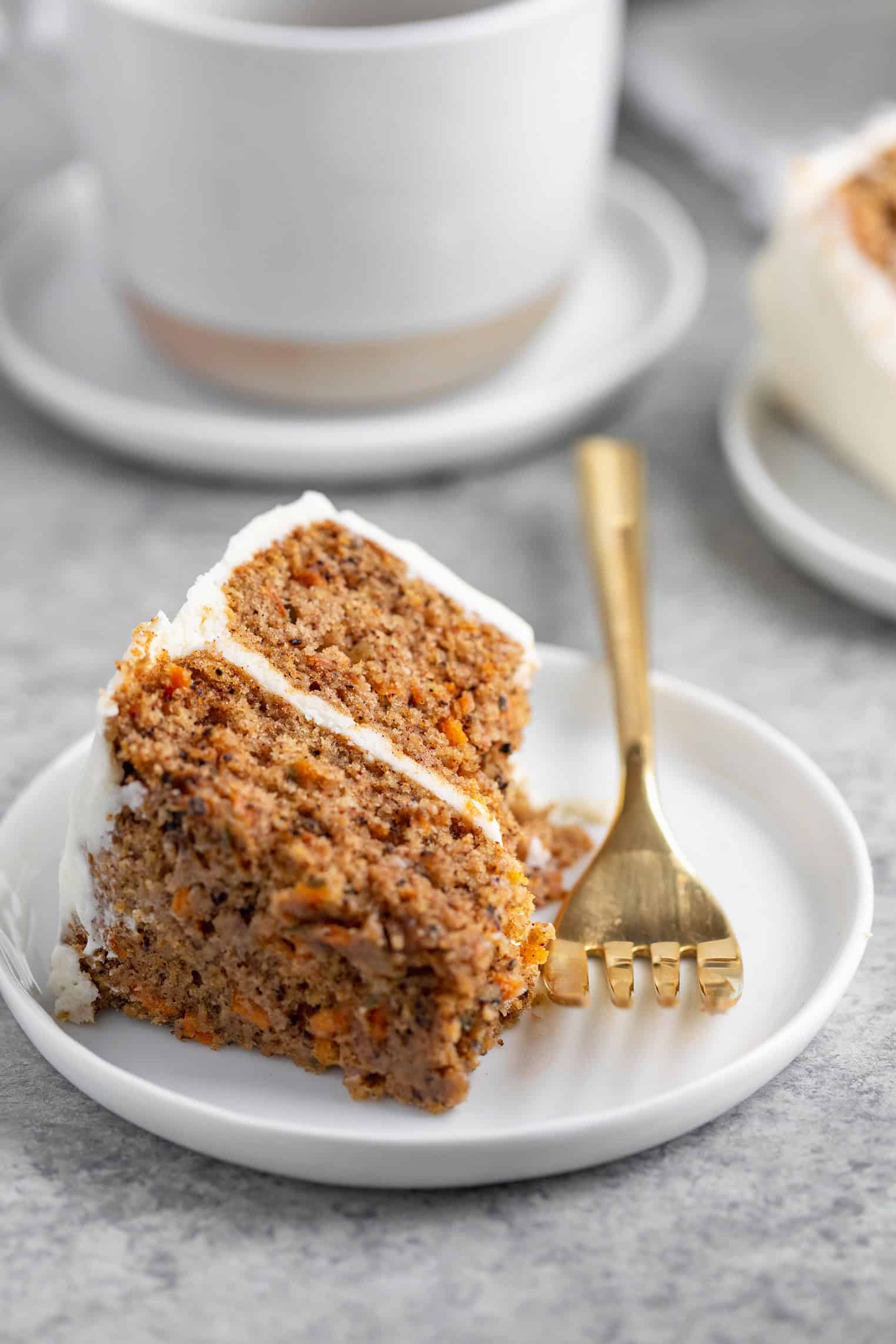 slice of vegan carrot cake with coffee