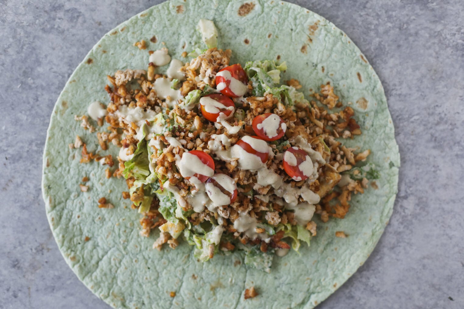 Vegan Chicken Caesar Wrap With Romaine, Tomatoes, And Caesar Dressing