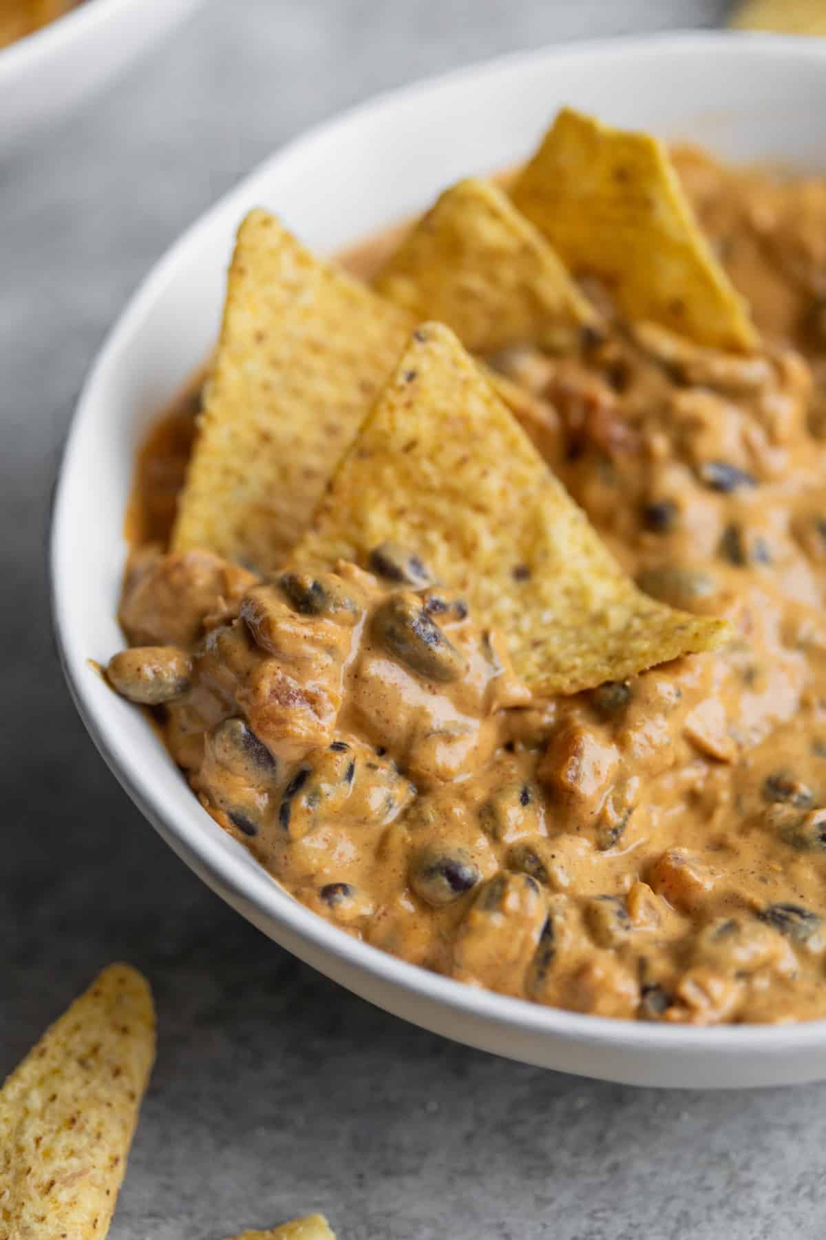 Chili Cheese Dip With Chips In A Bowl