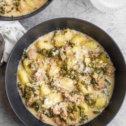 Bowl Of Soup With Kale, Vegan Sausage And Gnocchi