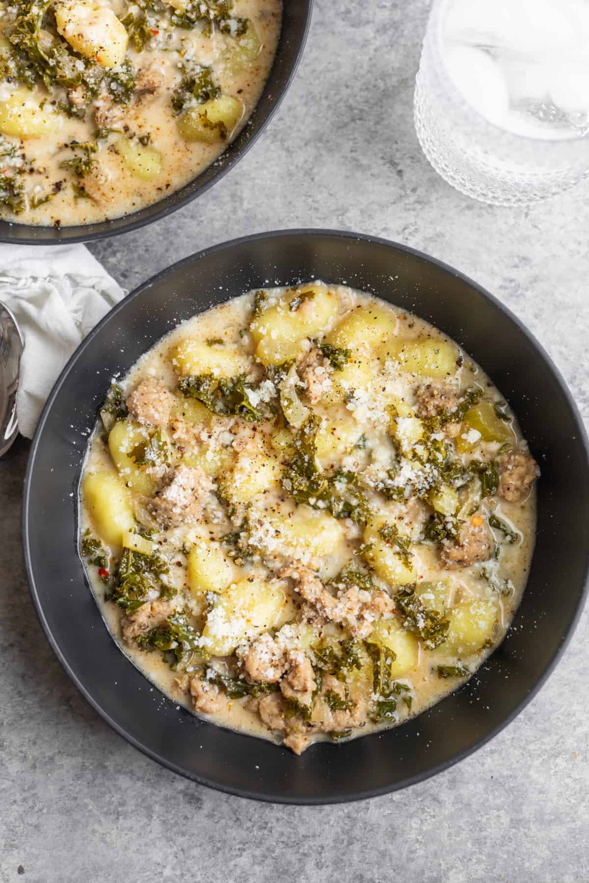 Bowl Of Soup With Kale, Vegan Sausage And Gnocchi