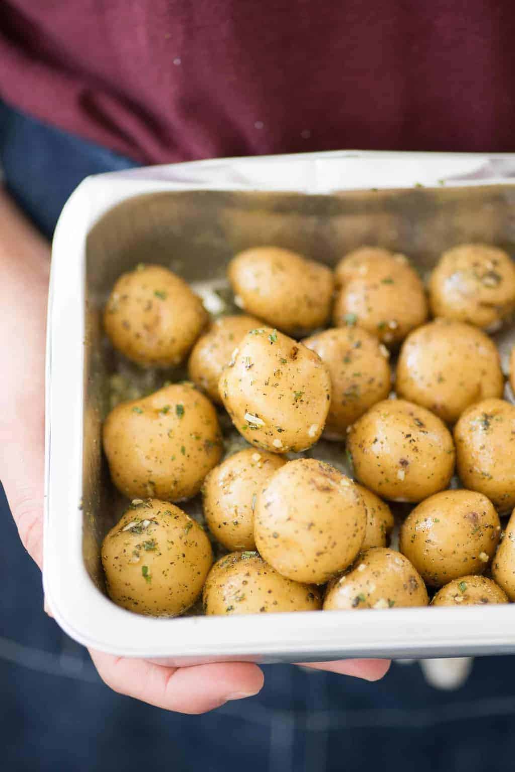These nacho bowls are SO easy! Grilled potatoes covered with beans, corn, jalapenos and a creamy chipotle sauce. Vegan and Gluten-Free. | www.delishknowledge.com 