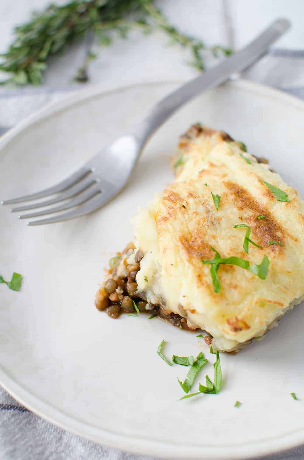 Lentil Shepherd's Pie! A rich, vegan lentil stew topped with homemade mashed potatoes. | www.delishknowledge.com